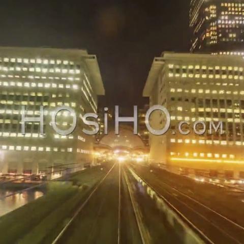 Hyperlapse Of The Docklands In London In Motion From A Fast Moving Train At Night, United-Kingdom